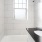 shower/tub combo in bathroom with window
